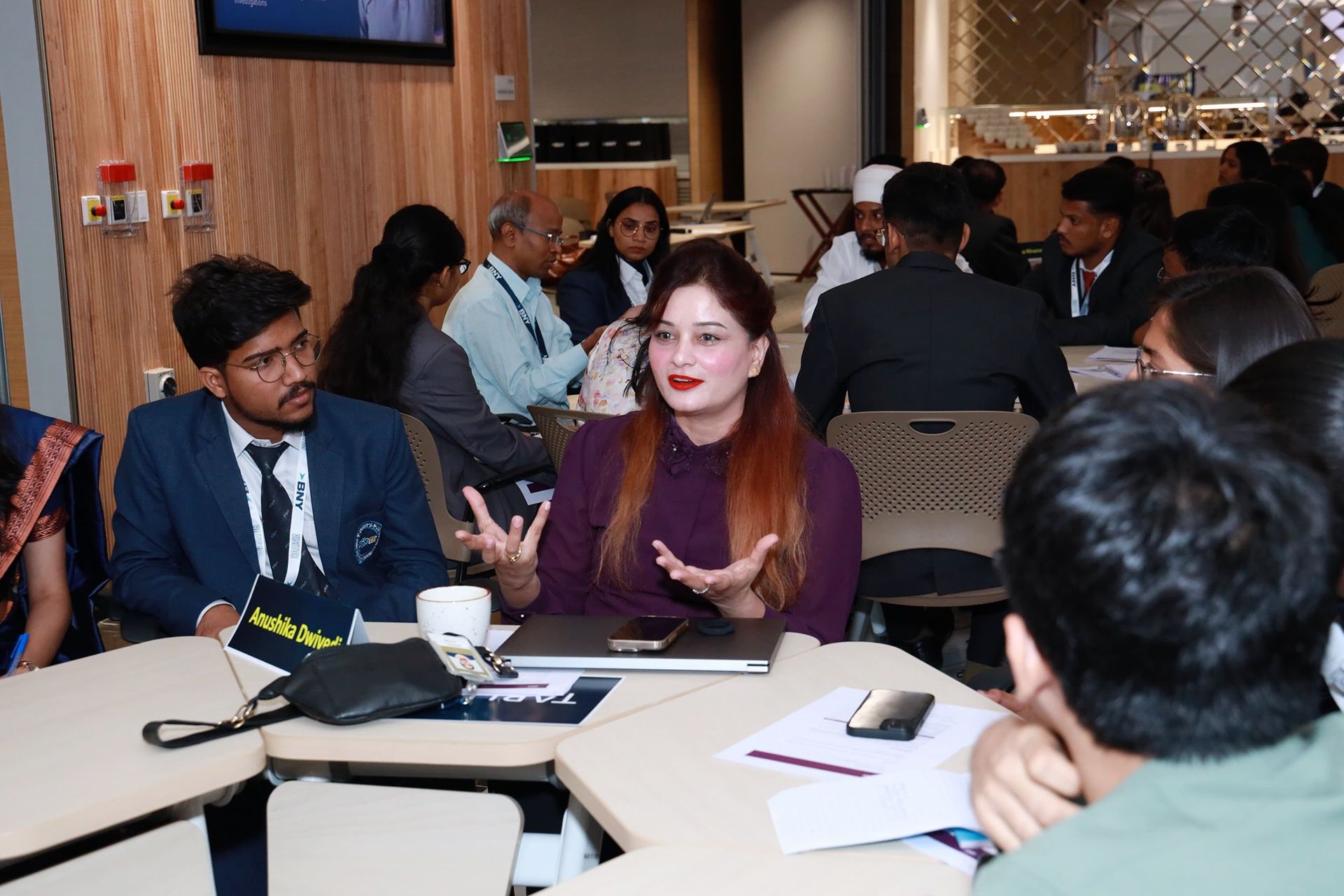 Anushikha Dwivedi in a one-on-one coaching conversation at a corporate offsite