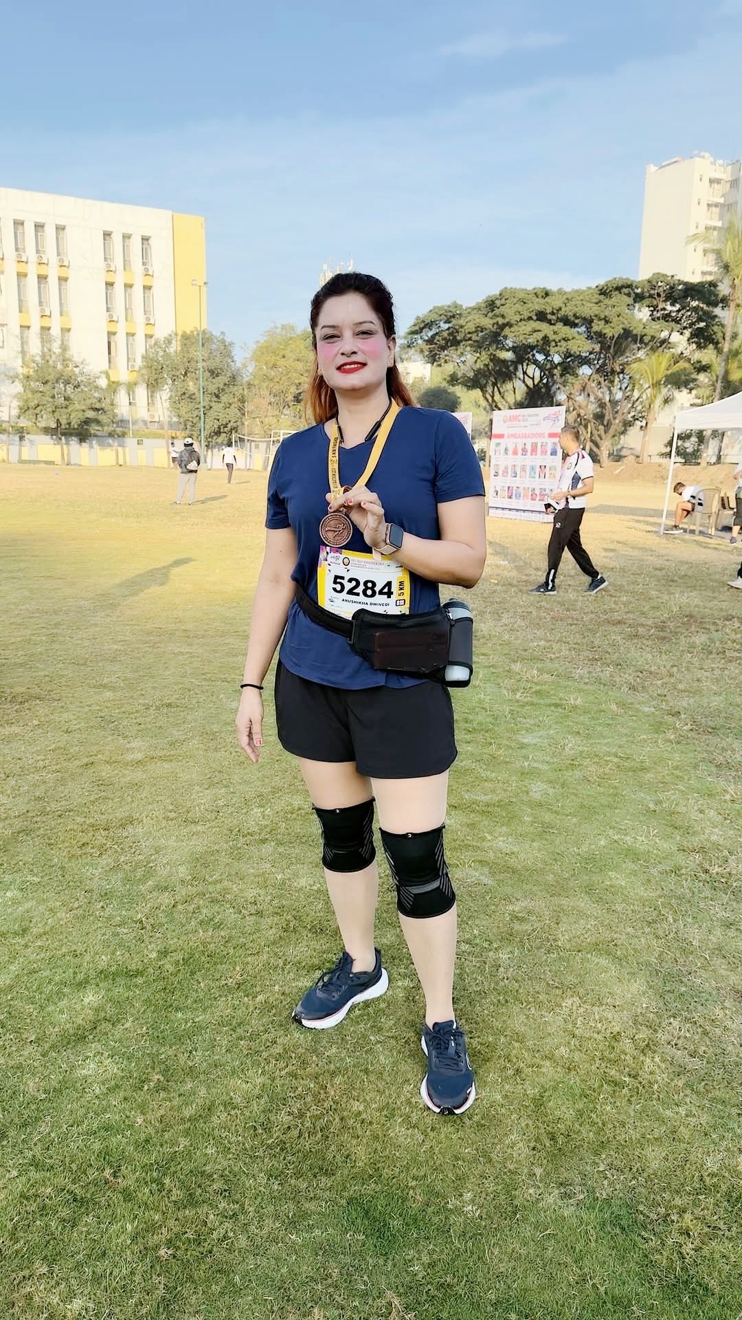 Anushikha Dwivedi with a marathon finisher medal