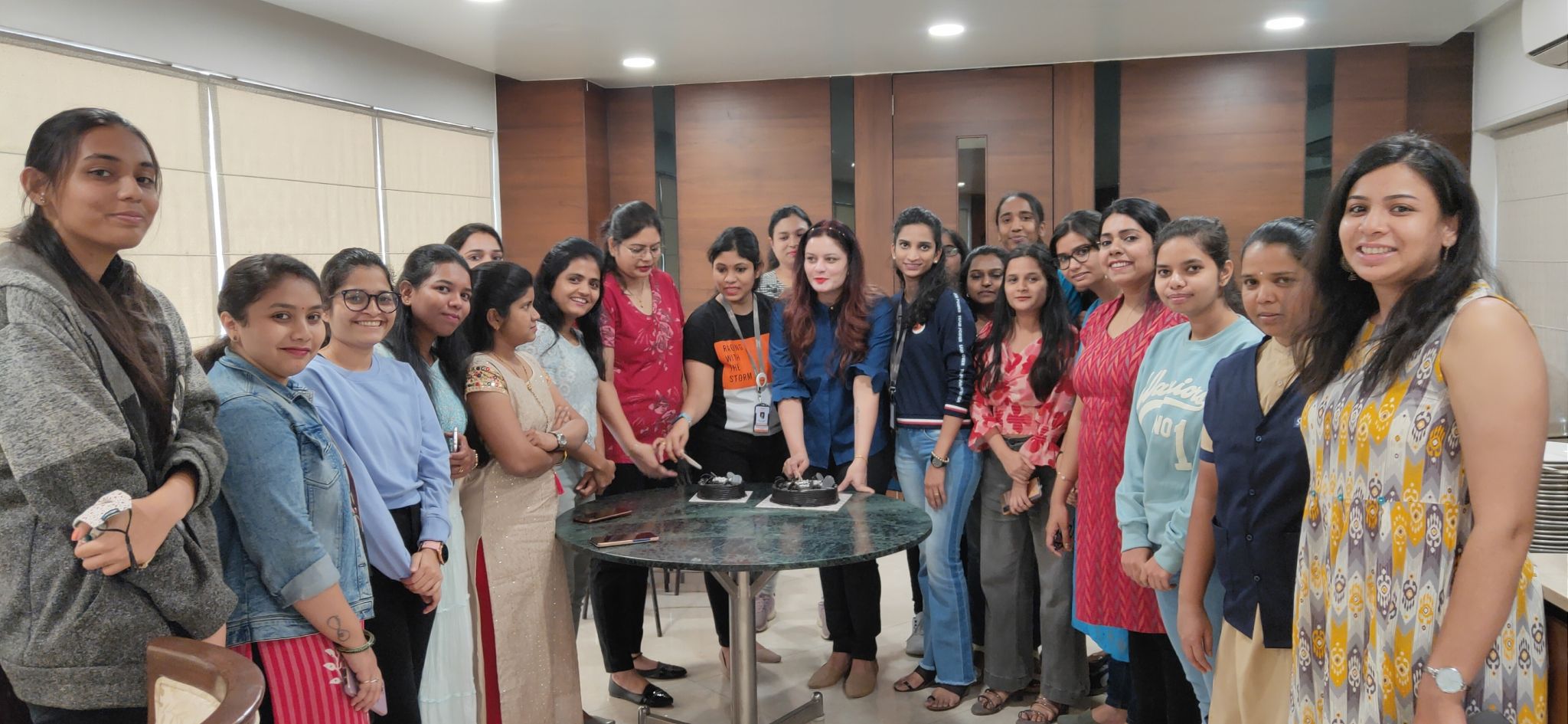 Anushikha Dwivedi celebrating with a women's empowerment group